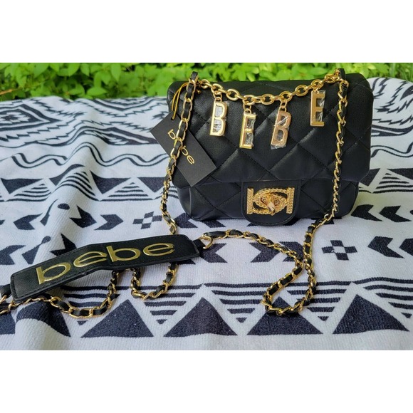 NWT bebe WYATT V-FLAP SHOULDER BAG. Mini. Black With Gold Hardware - Picture 1 of 12